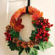 I wanted this handmade holiday wreath to incorporate both fall and winter motifs. 