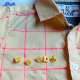 After drawing the grid, I sewed on the letter buttons to make the name Woody. 