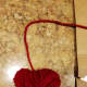 Cut the yarn, leaving enough to hang your heart up.
