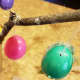 Hang your eggs on the branches. Add colorful pieces of thread, beads, or other items to customize your tree.