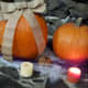 Burlap strands or ribbons make a wonderful bow on pumpkins. Add a few candles and your centerpiece is simple yet beautiful.