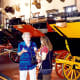 Inside the building showcasing the collection of old coaches and carriages.