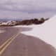White sand encroaching upon the road.