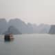 Boat sailing off into Halong Bay, Vietnam.
