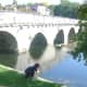 Boy on Le pont coud&eacute;, Brantome. Also called 'the right angle bridge'