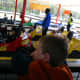 Our six year old son waits in line for the Family 500. He was not tall enough to drive, but could ride as a passenger.