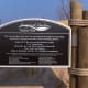 A proud dedication toward community efforts responsible for saving the pristine coastal dune landscape directly adjacent to Oval Beach's northern portion
