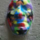 A mask decorating a side street (c) A. Harrison