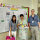 L-r: Clap Global founder Shirin Johari, teacher Ms Seema and me next to a map showing where Clap Talk travellers are from.