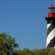 St. Augustine Lighthouse with its black and white spiral-striped tower.
