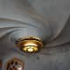 The ceiling that has a spiraling wave that looks like water.