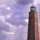 Old Cape Henry Lighthouse with 2 F-18s passing by in the distance from NAS Oceana.