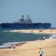 Aircraft Carrier entering Chesapeake Bay at First Landing State Park in Virginia Beach, Virginia.