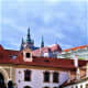 Prague Castle looms over Wallenstein Palace.