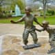 Sculptures of Kids Skateboarding and Rollerblading