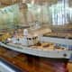 Reflection of my husband looking at the model of Calypso
