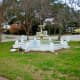 Antique dolphin fountain in need of repair