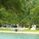 Bridal photos being taken near reflection pool in Hermann Park