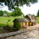 Miniature buildings along train tracks in Zube Park