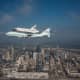  Space Shuttle Endeavour is ferried by NASA's Shuttle Carrier Aircraft (SCA) over Houston, Texas on September 19, 2012
