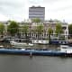 Working barge passing the Amstel Hotel.