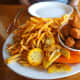 A pound of fried scallops and crispy french fries. We ate on the outside deck where we had a great view of sailboats moored at the dock.