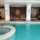 Sunbeds in alcoves by the pool.