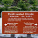 Continental Divide sign at Milner Pass on Trail Ridge Road in Rocky Mountain National Park