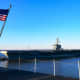 USS Abraham Lincoln pass the USS Harry S. Truman as it leaves Naval Station Norfolk in Norfolk, VA