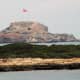 The flags of Northern Cyprus fly at the end of the Karpaz Peninsula.