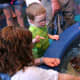 The horseshoe crab touch pool had more room to see the animals, and the animals were accessible. My four year old son looks at the underside of the crab.