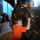 Spinning a ship's wheel. Both boys liked this little &quot;island.&quot;
