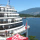 A cruise ship with part of Stanley Park in the background