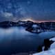 Crater Lake at night reflecting a star-lit sky
