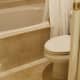 The toilet area. Notice the beautiful tile work and how clean the area is.