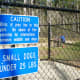 Warning sign in the small dog park area