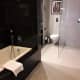 Bath, with shower and WC beyond.