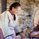 Costumed interpreters making bread as they did in the 1800s, at Upper Canada Village.