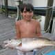 A little angler with a big redfish!