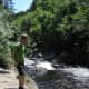 My son, Steve, on the shore of the West Branch of the Pleasant River.  Check out the Five Fingers hiking shoes.
