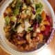 Salad with almonds-cranberries, red and orange oranges sliced, rotisserie chicken