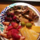Grilled Turkey breast cut into chunks, cherries, cheese slices and a couple of olives