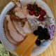 Grilled chicken, cheese slices, cherries and black berries