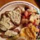 Grilled Salmon fillets topped with Alloette cheese, zuchini with cheese and onion bake, fruits