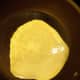 7. When most of the crepe is cooked and edges are curling up, crepes are done on that side. Lift with a spatula and quickly turn over.