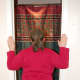 Place hands on door frame, with elbows below shoulders, and lean into door opening.