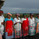 Xhosa ladies.It is important for women to look dignified at all times particularly if there is a cultural ritual. Women must cover their head at all times and have a scarf around their waist and have something to put on their shoulders. This is a sig