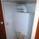 The combi-boiler in a cupboard in our bathroom, which provides all the hot water on demand for the central heating radiators and hot water taps.