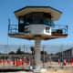 Guard tower and inmates in recreation