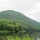 Pine Creek at Waterville, PA, canoes and swim platform in the foreground.